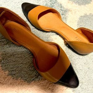 Cute black/tan flats worn a couple, similar to d’Orsay flats.